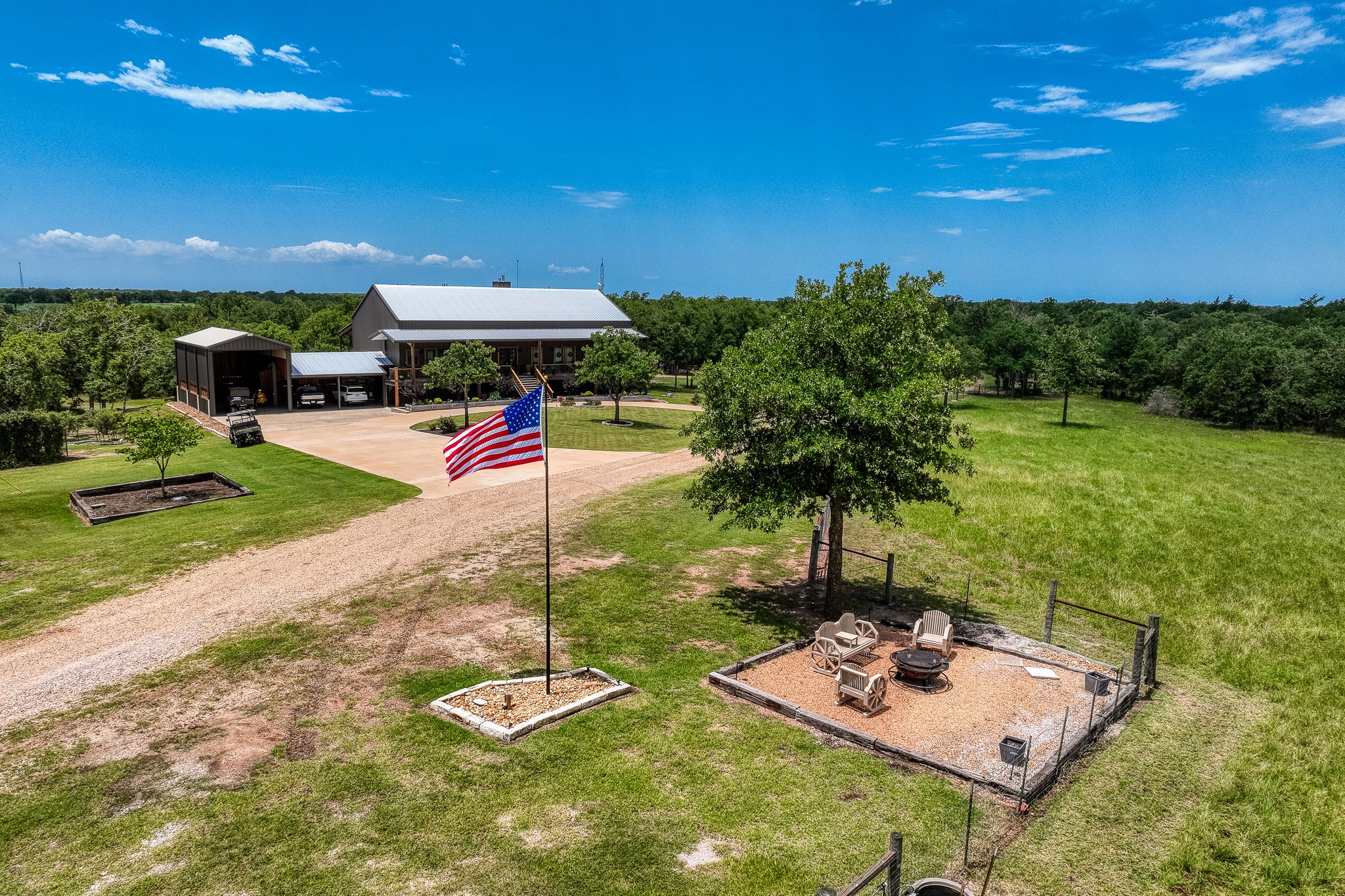 10092 County Road 446 Somerville, TX 77879 - Photo 28 of 50 a view of a backyard with plants and outdoor seating