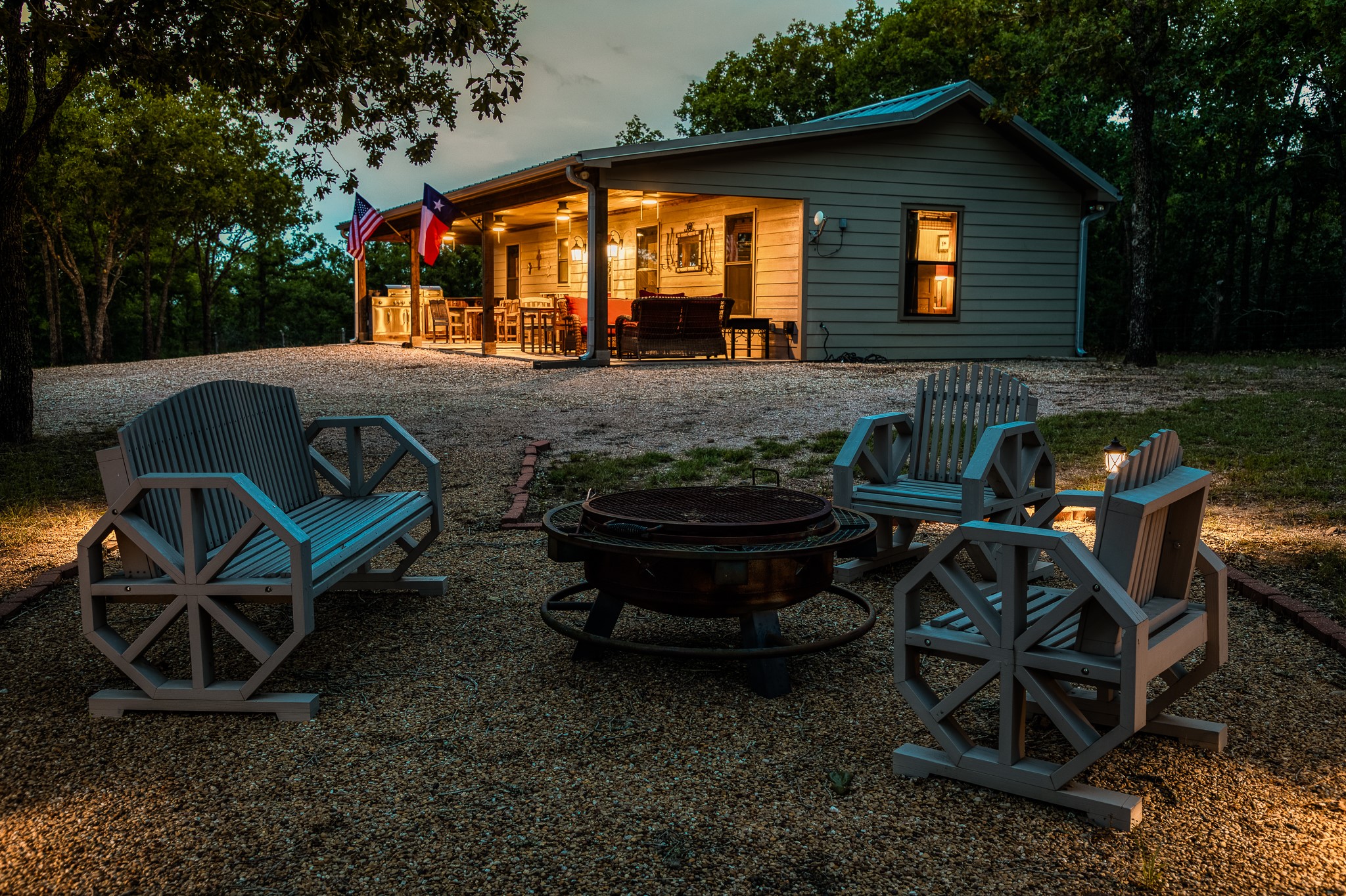 10092 County Road 446 Somerville, TX 77879 - Photo 31 of 50 a backyard of a house with barbeque oven table and chairs