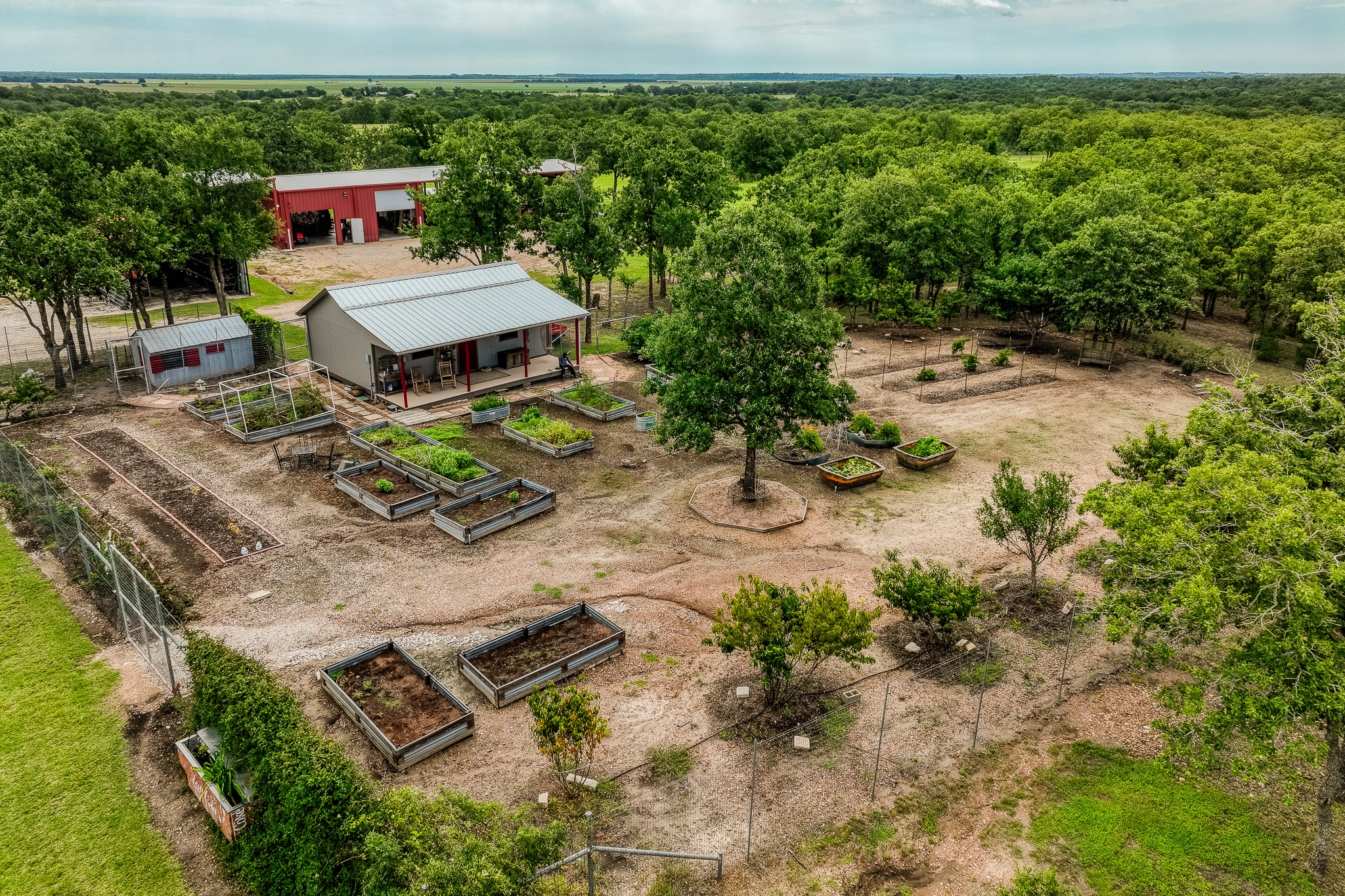 10092 County Road 446 Somerville, TX 77879 - Photo 37 of 50 an aerial view of a yard with table and chairs