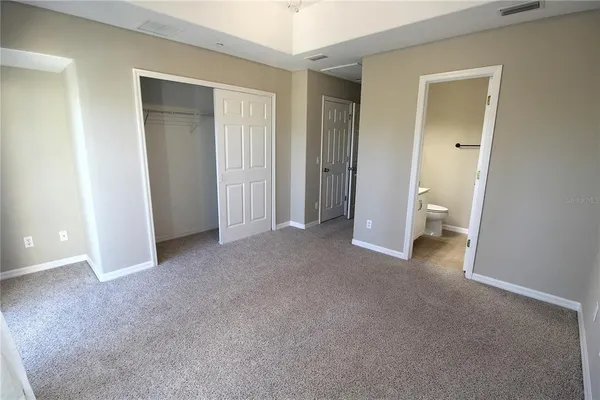 a view of room with a bathroom and a toilet