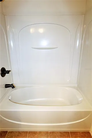 a view of a garden with a building in the background