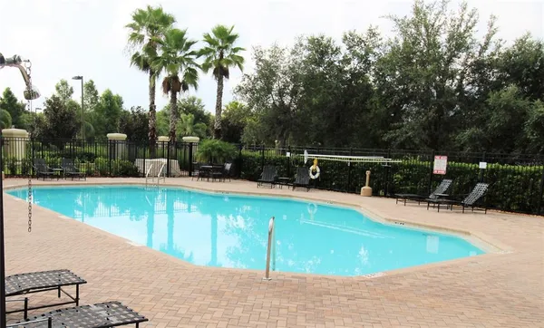 a view of a swimming pool with a patio