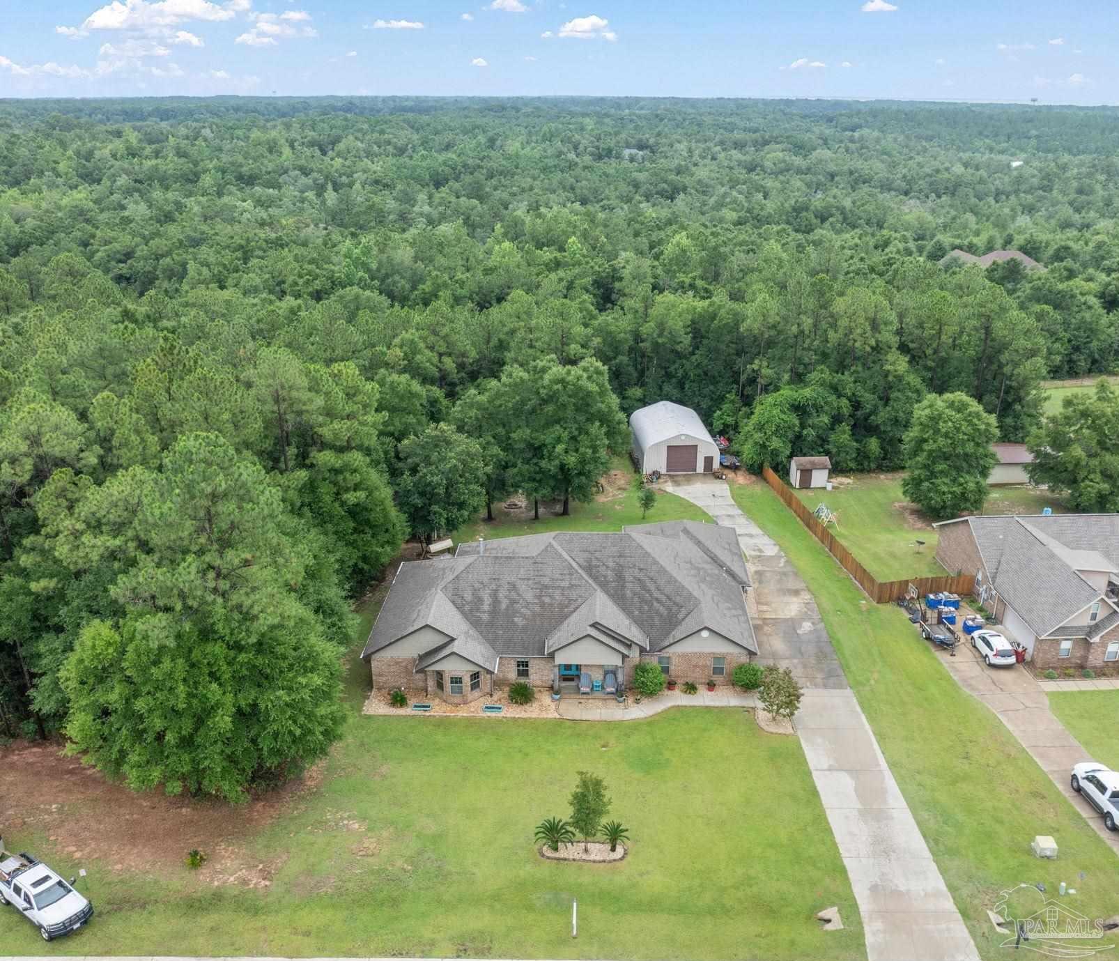 a view of a swimming pool with a yard