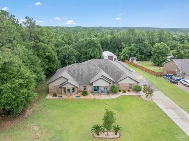 a view of a house with a big yard