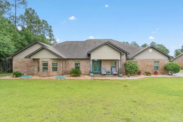 a front view of a house with a yard and porch