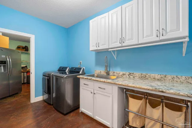 a view of a patio with couches table and chairs and wooden floor