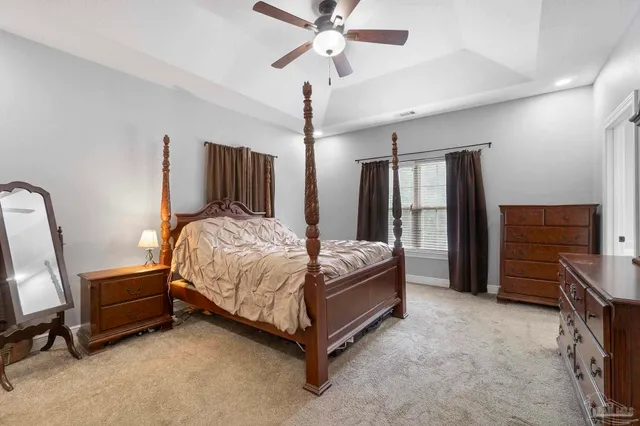 a room with lots of wooden furniture and a window