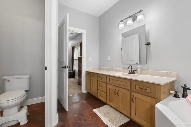 an aerial view of a house with a yard and lake view