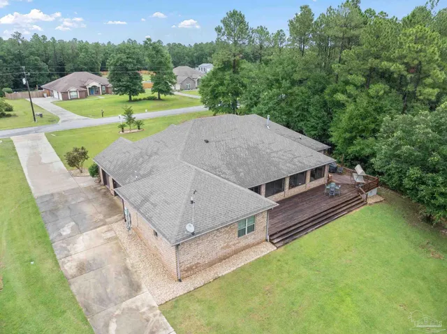 a view of a backyard with tree s