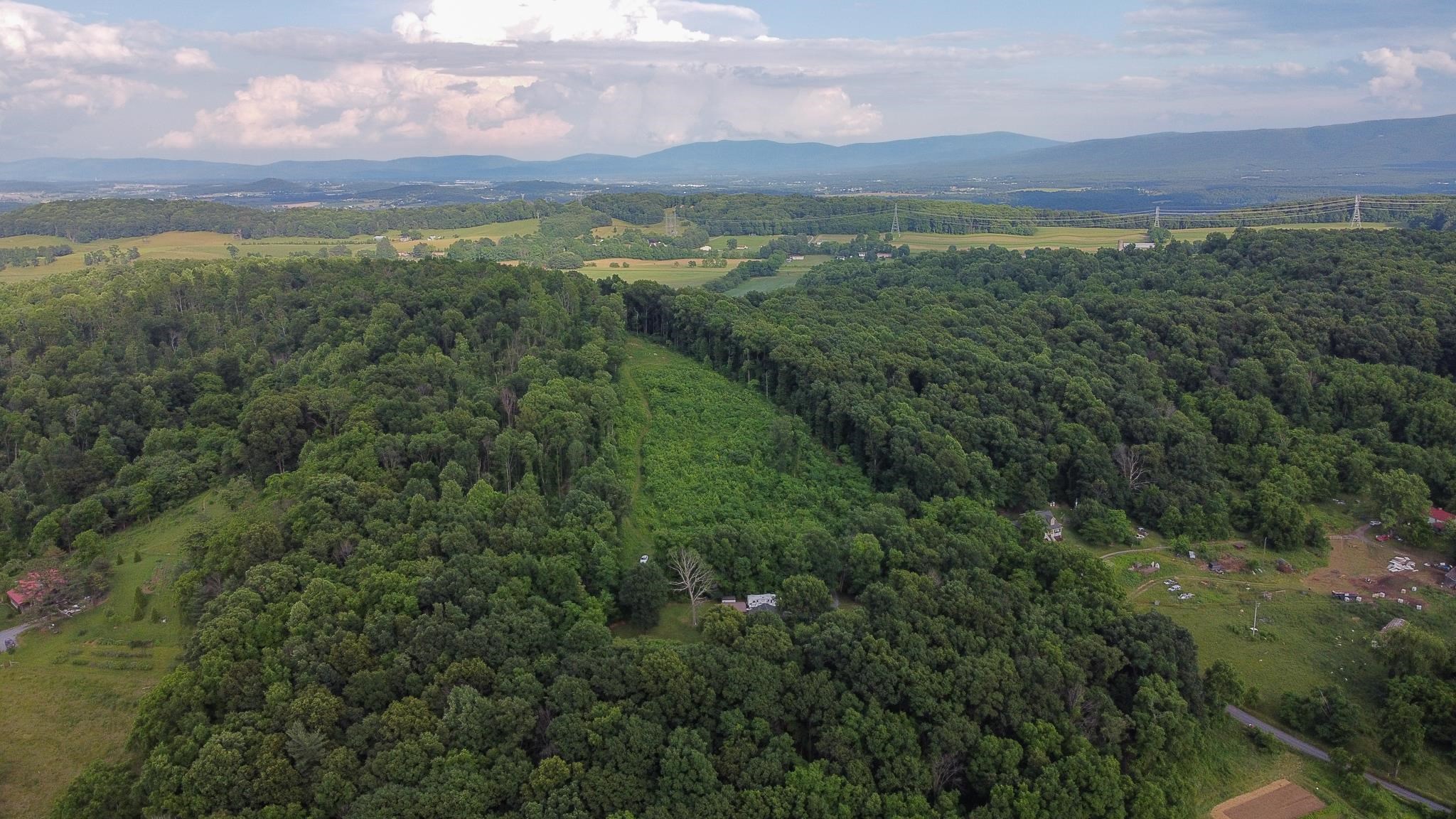 Tbd Rosen Lane Staunton, VA 24401 - Photo 3 of 14 a view of a lush green hillside and a houses