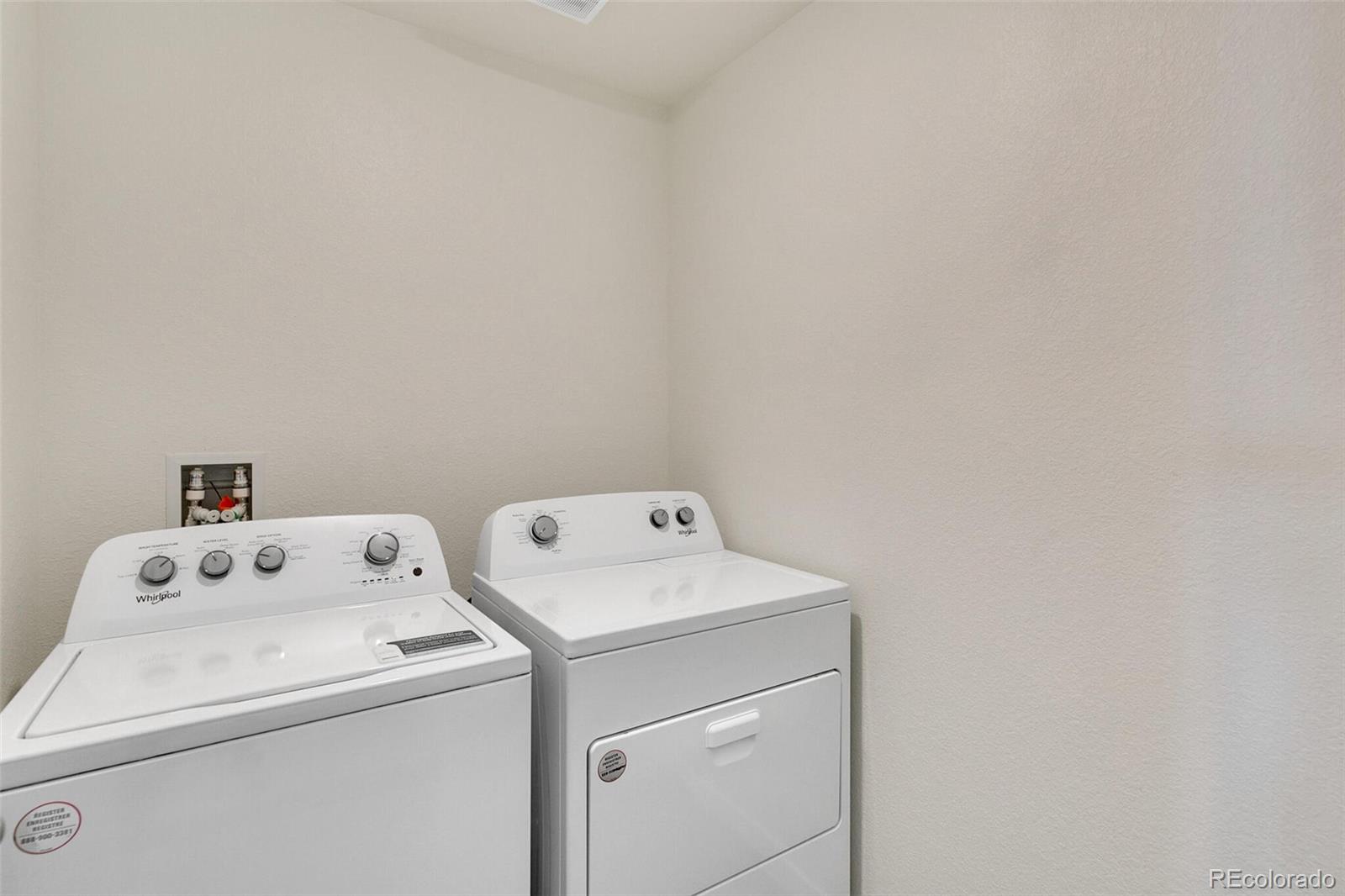 6907 Zig Place Frederick, CO 80530 - Photo 24 of 36 a utility room with dryer and washer