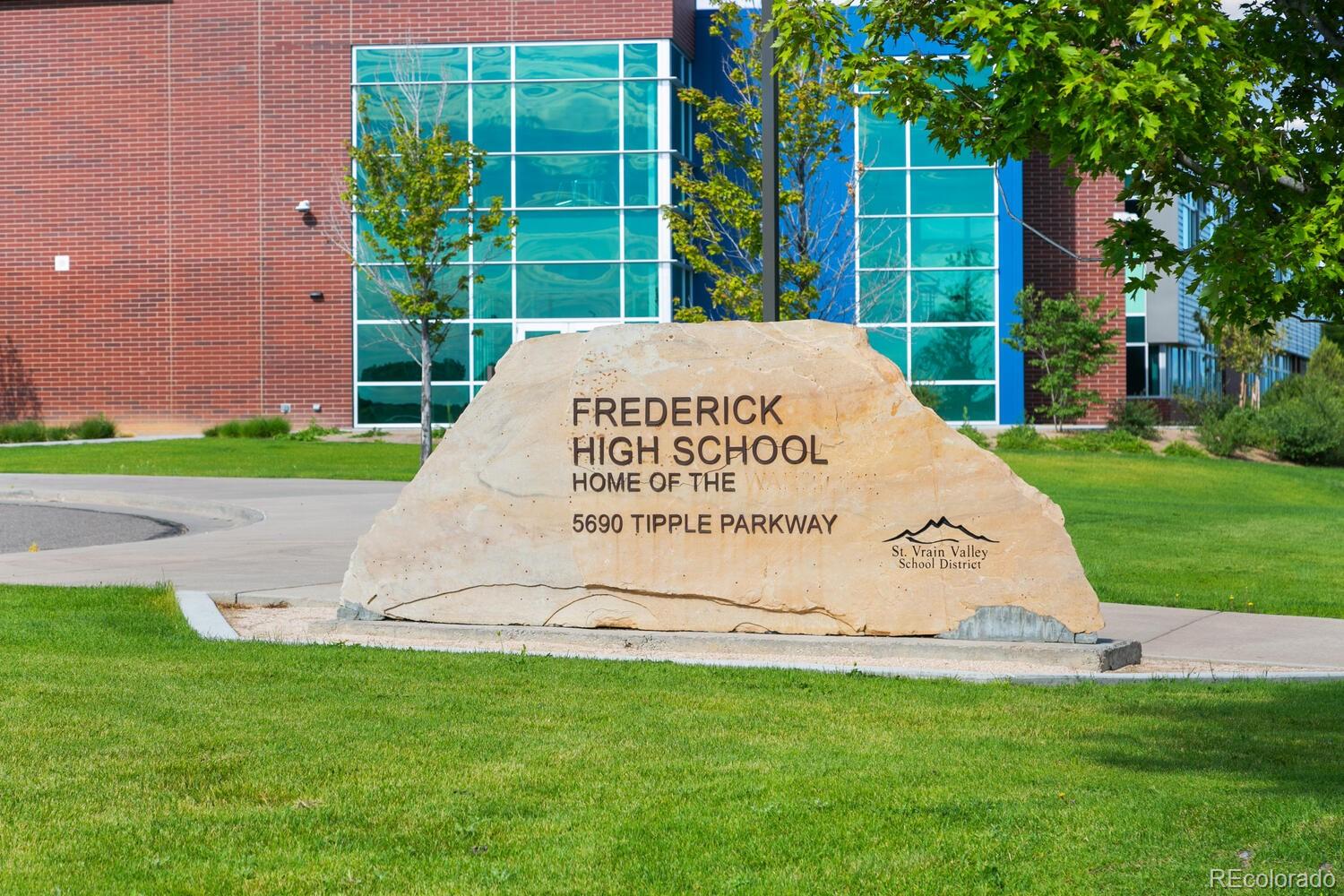 6907 Zig Place Frederick, CO 80530 - Photo 31 of 36 a sign on the side of the grass and plants