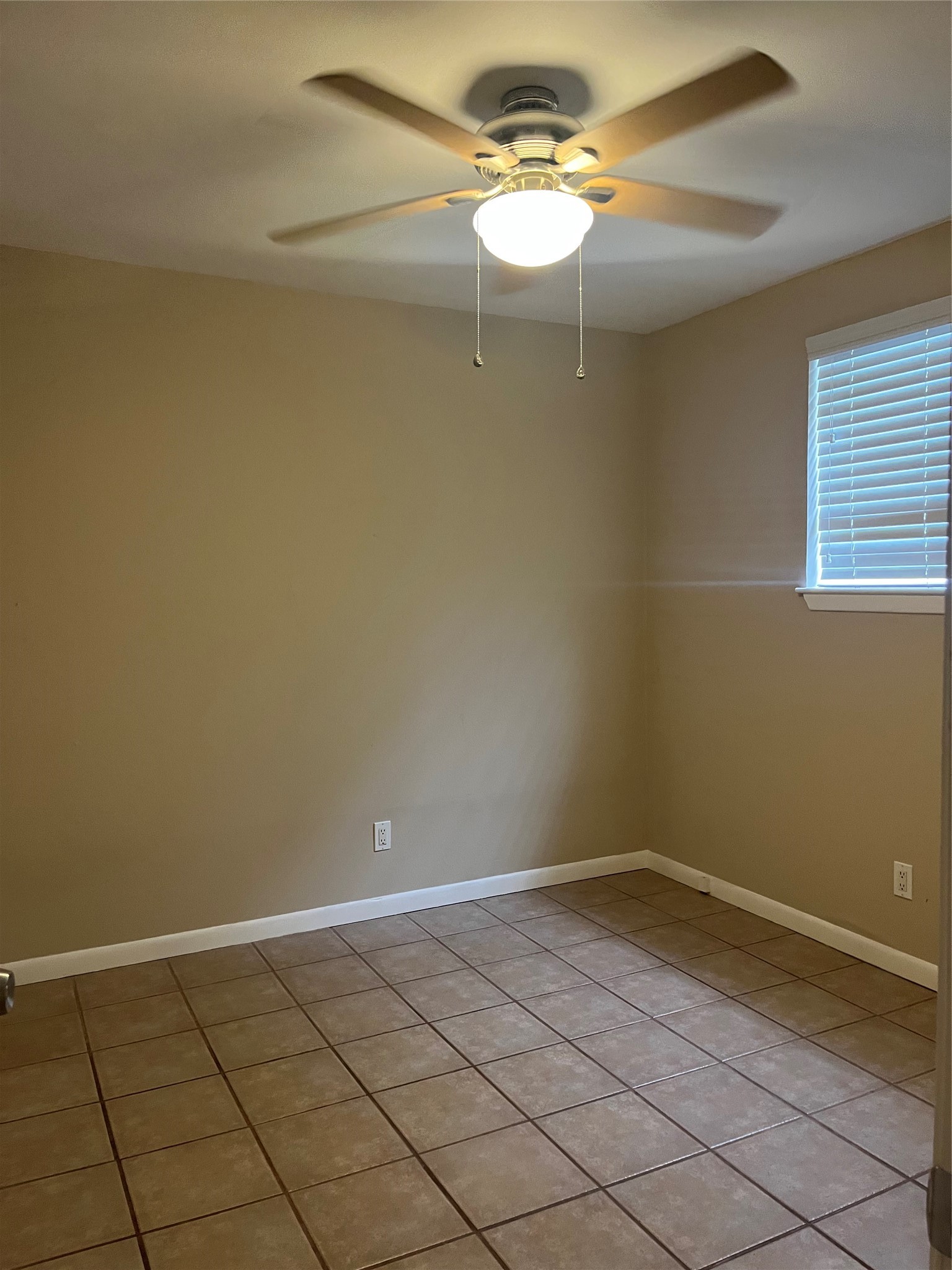 4010 Feagan Street, Unit 5 Houston, TX 77007 - Photo 6 of 11 a view of a room with an empty space and a ceiling fan