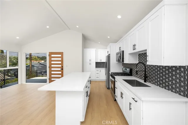 a view of a balcony with floor to ceiling window with wooden floor