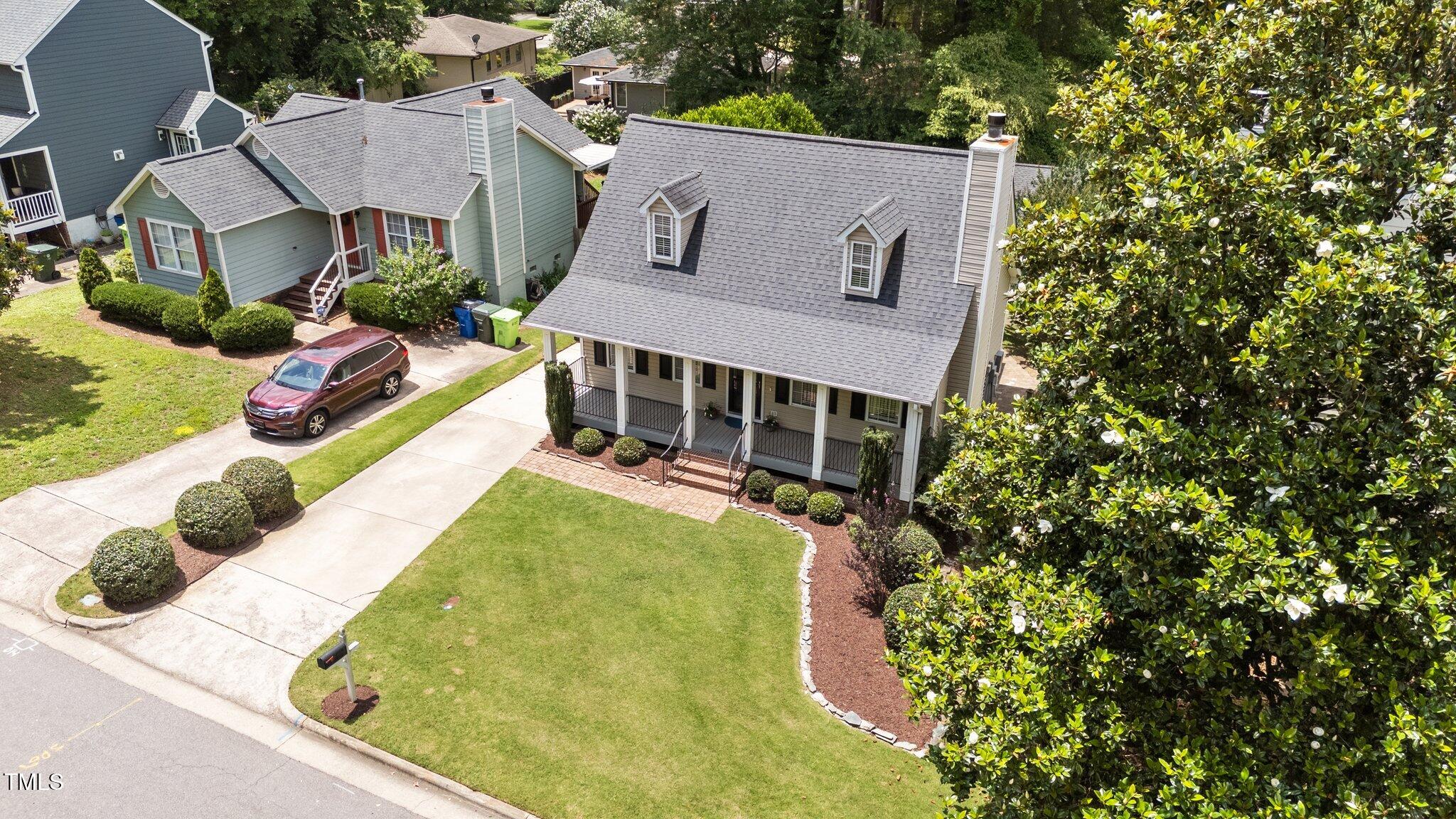 1033 Mills Street Raleigh, NC 27608 - Photo 4 of 36 4-web-or-mls-DJI_20250609132145_0943_D