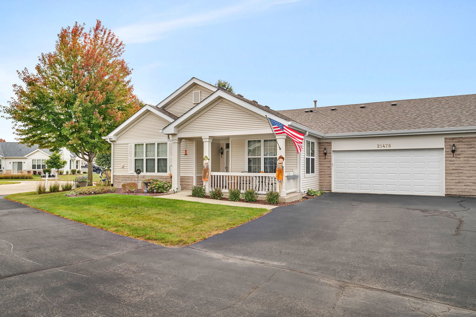 a view of a house with a yard and garage