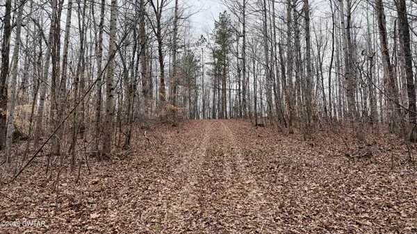 a view of small space with wooden fence