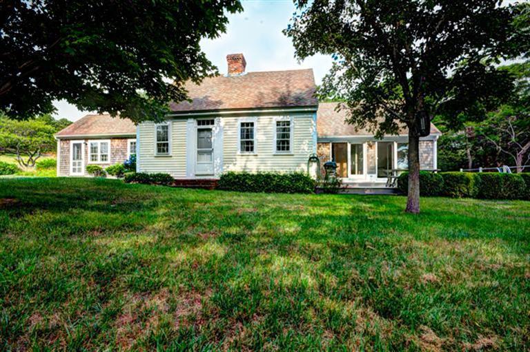 4 Stick Bridge Road Truro, MA 02666 - Photo 1 of 17 a front view of house with yard and green space