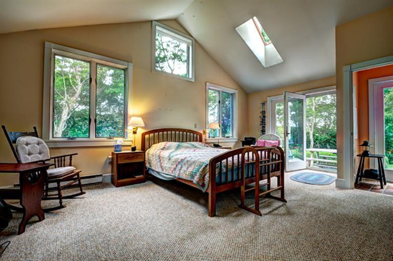 4 Stick Bridge Road Truro, MA 02666 - Photo 13 of 17 a bedroom with a bed chair and a large window