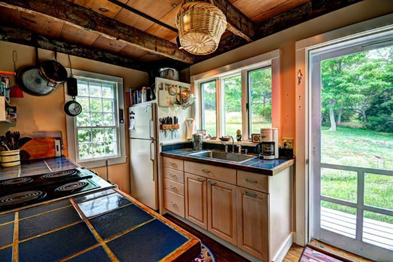 4 Stick Bridge Road Truro, MA 02666 - Photo 10 of 17 a kitchen with stainless steel appliances granite countertop a stove a sink and a refrigerator