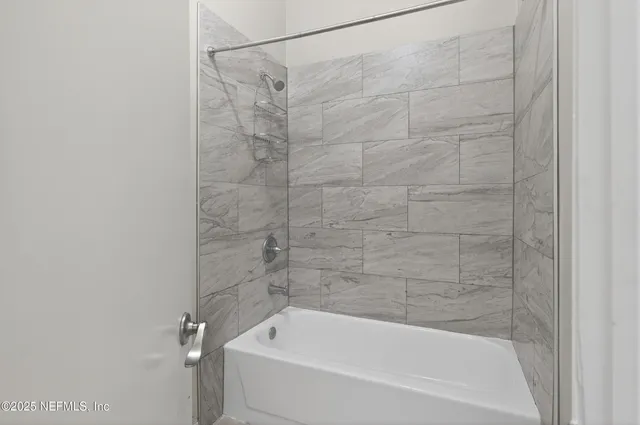 a close up of a bathtub curtain