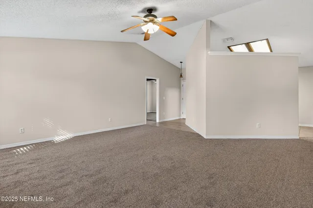a view of a room with ceiling fan