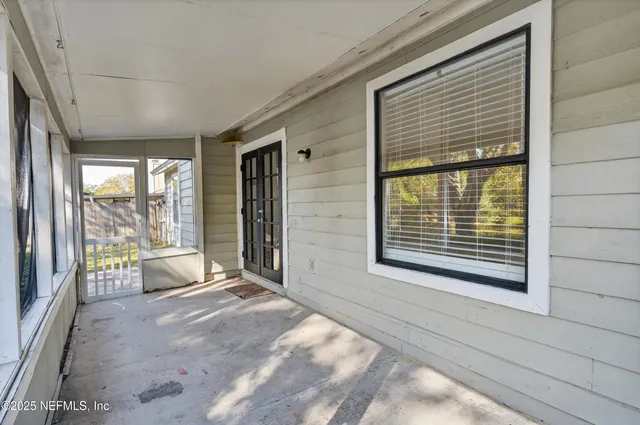 a view of an empty room and window