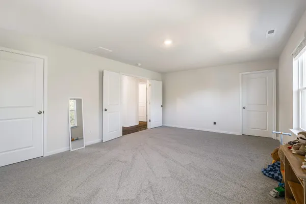 a bathroom with a granite countertop sink tub and a mirror