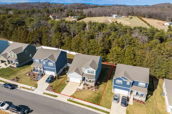an aerial view of a house with outdoor space