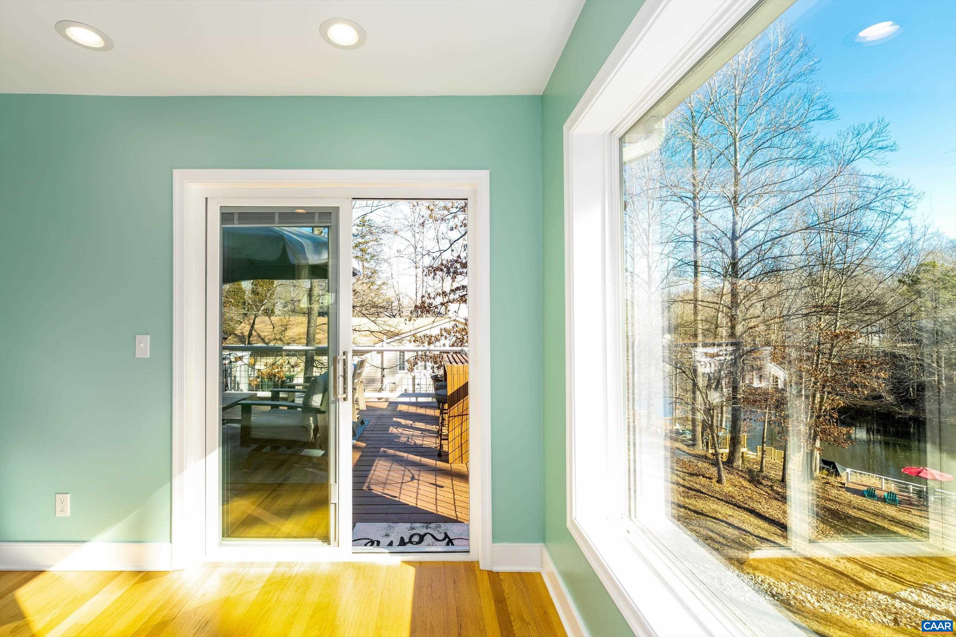 9 Vine Ridge Drive Palmyra, VA 22963 - Photo 24 of 73 a view of a living room with a floor to ceiling window and wooden floor