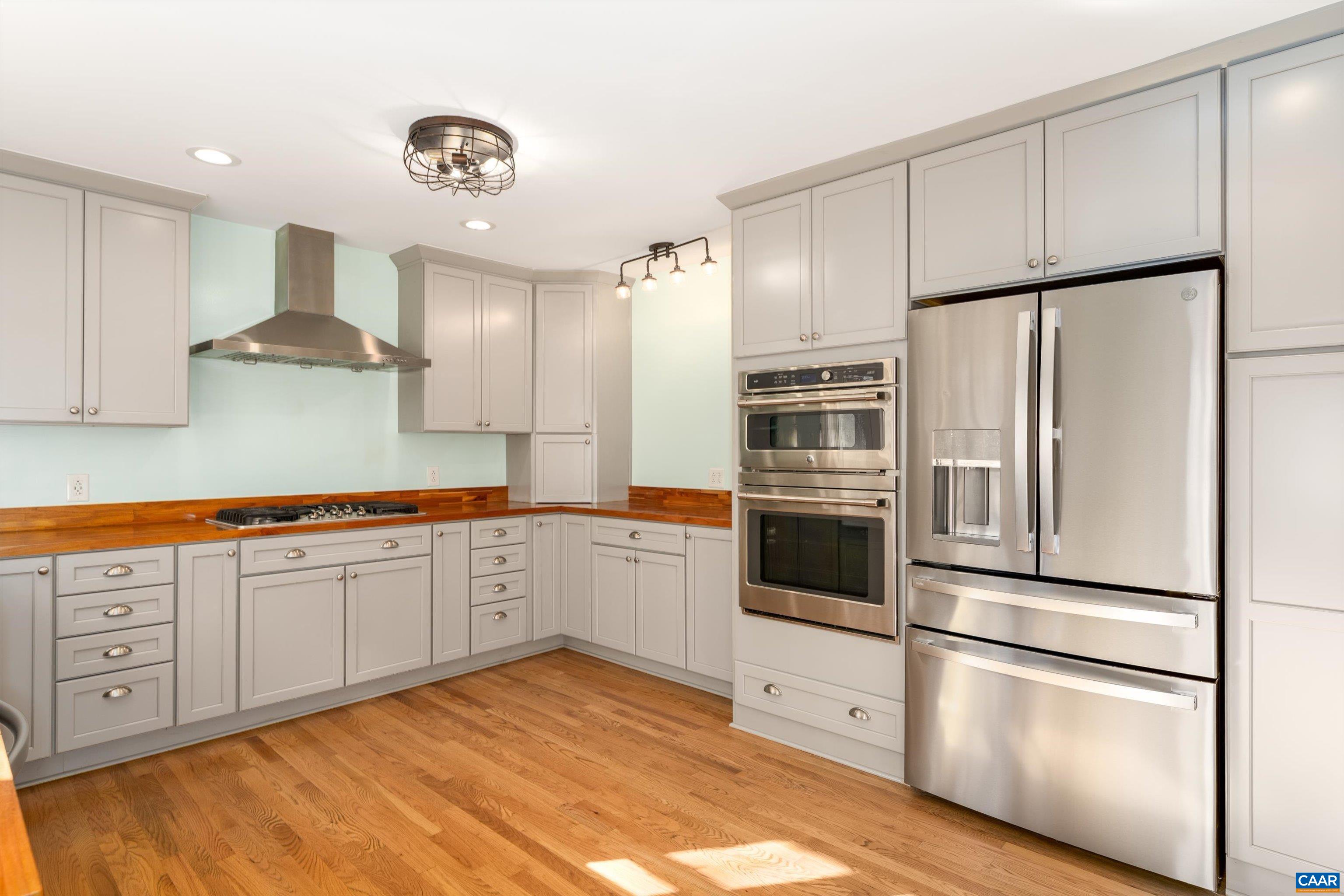 9 Vine Ridge Drive Palmyra, VA 22963 - Photo 31 of 73 a kitchen with granite countertop white cabinets and stainless steel appliances