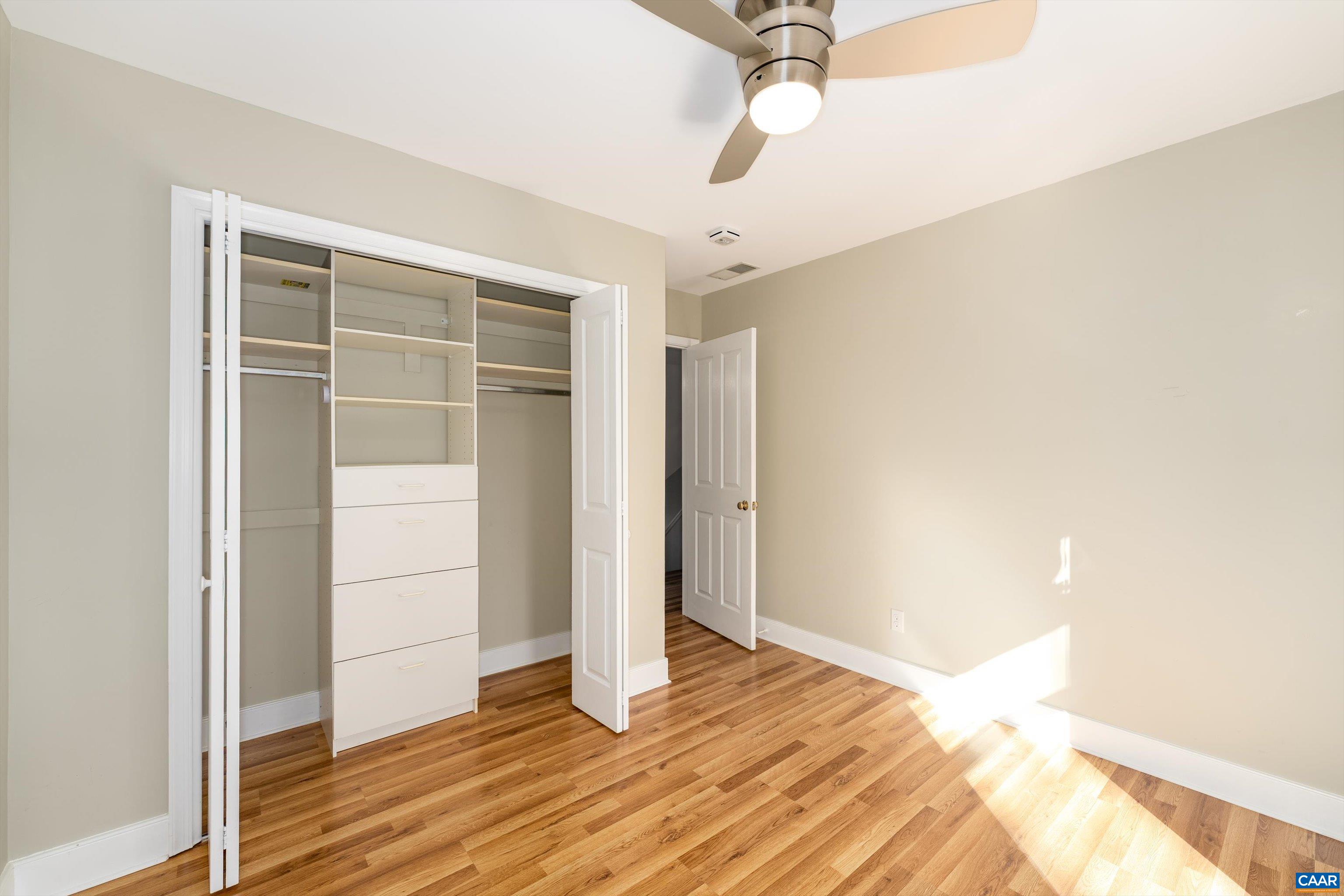 9 Vine Ridge Drive Palmyra, VA 22963 - Photo 46 of 73 a view of empty room with wooden floor and fan