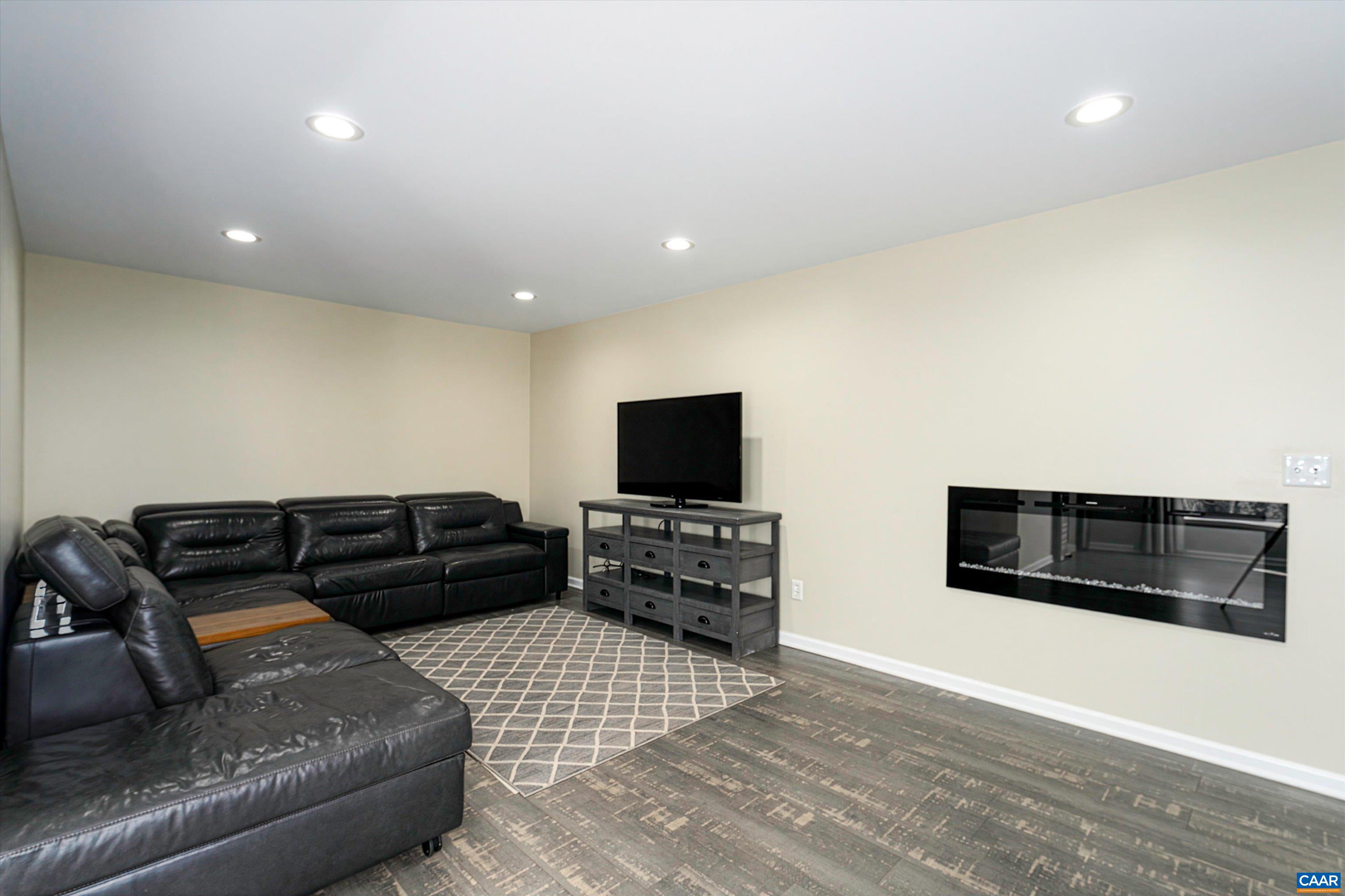 9 Vine Ridge Drive Palmyra, VA 22963 - Photo 59 of 73 a living room with furniture and a flat screen tv