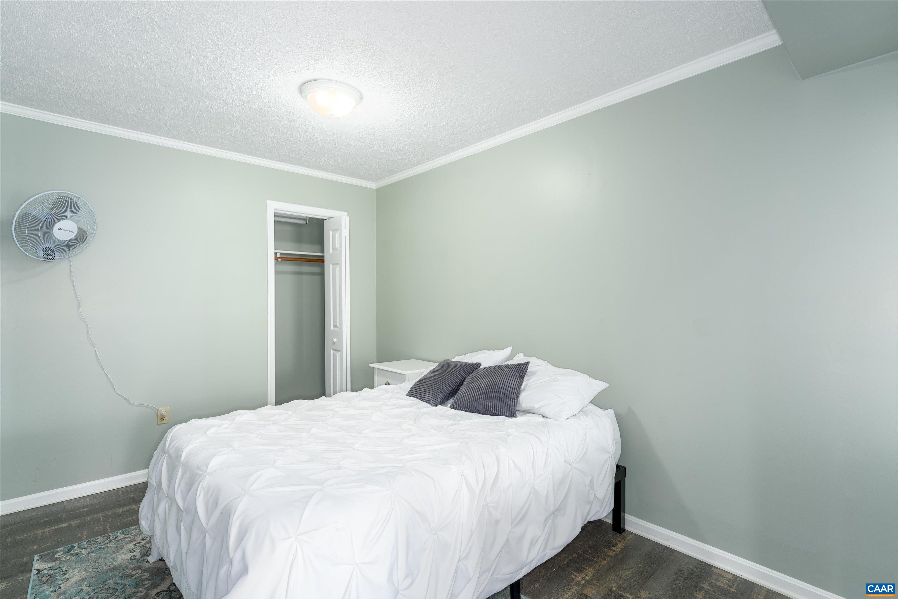 9 Vine Ridge Drive Palmyra, VA 22963 - Photo 68 of 73 a bedroom with a bed and a table