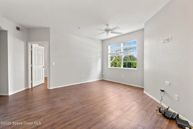 a view of a kitchen cabinets and wooden floor
