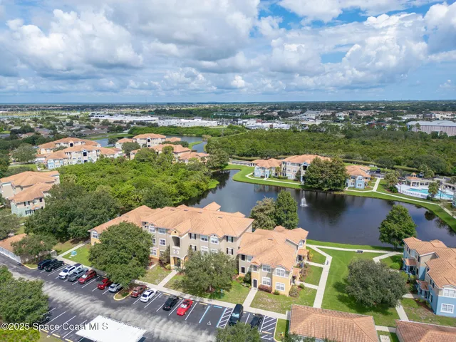 aerial view of a house with a lake view