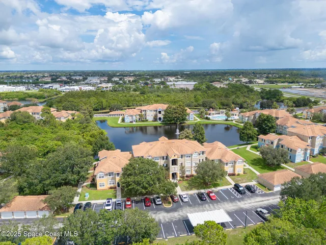 a view of a lake with houses in the back