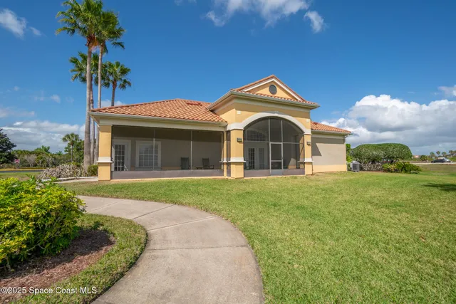 a view of swimming pool with a lounge chairs