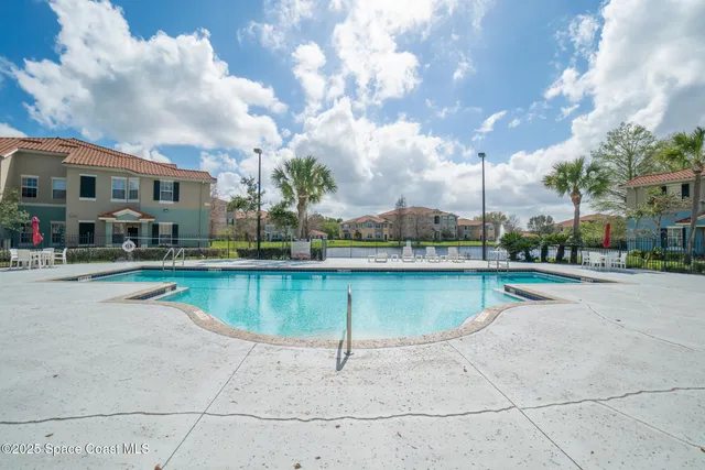 a view of houses with a swimming pool
