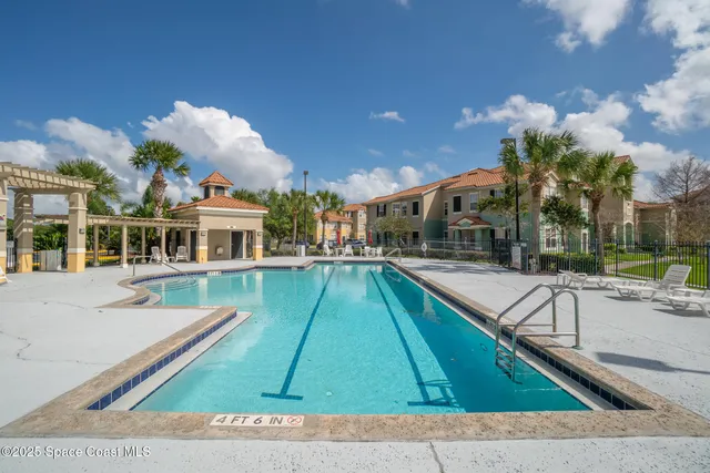 a view of a house with backyard and porch