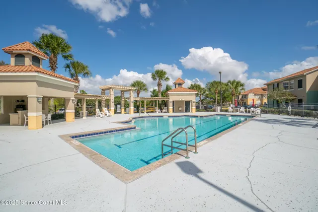 a view of a building with backyard