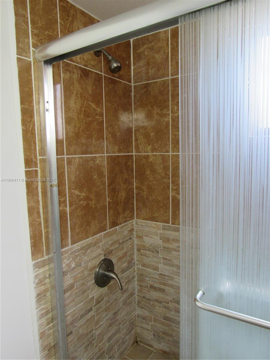 5490 West 21st Court, Unit 308 Hialeah, FL 33016 - Photo 11 of 21 a bathroom with a shower