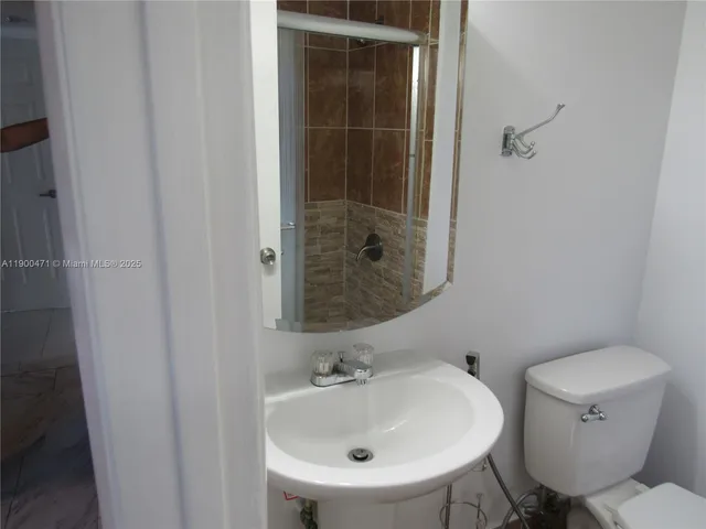 a bathroom with a sink and a toilet