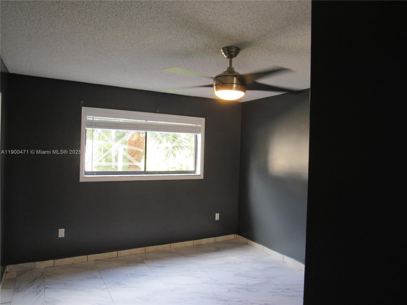 5490 West 21st Court, Unit 308 Hialeah, FL 33016 - Photo 15 of 21 a view of an empty room with a window