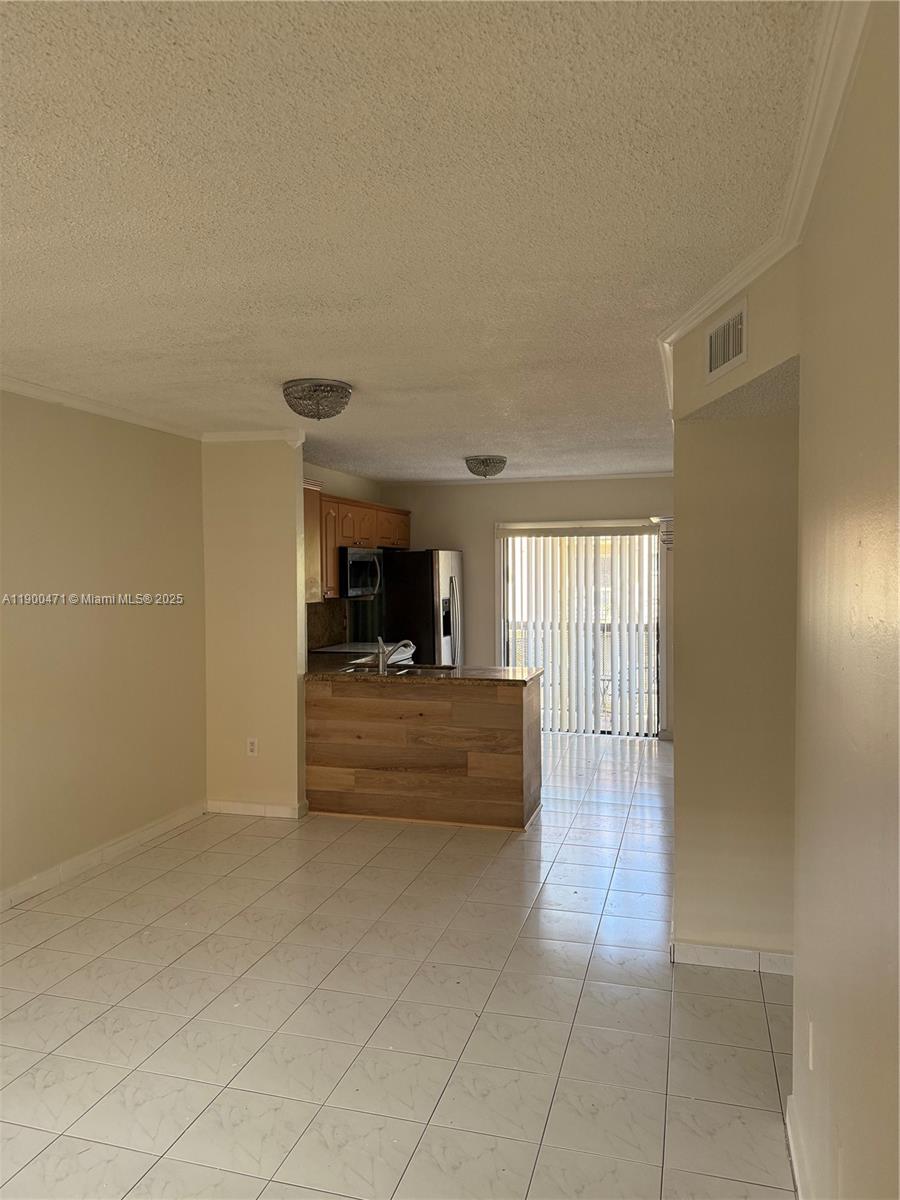 5490 West 21st Court, Unit 308 Hialeah, FL 33016 - Photo 2 of 21 a view of living room filled with furniture and window