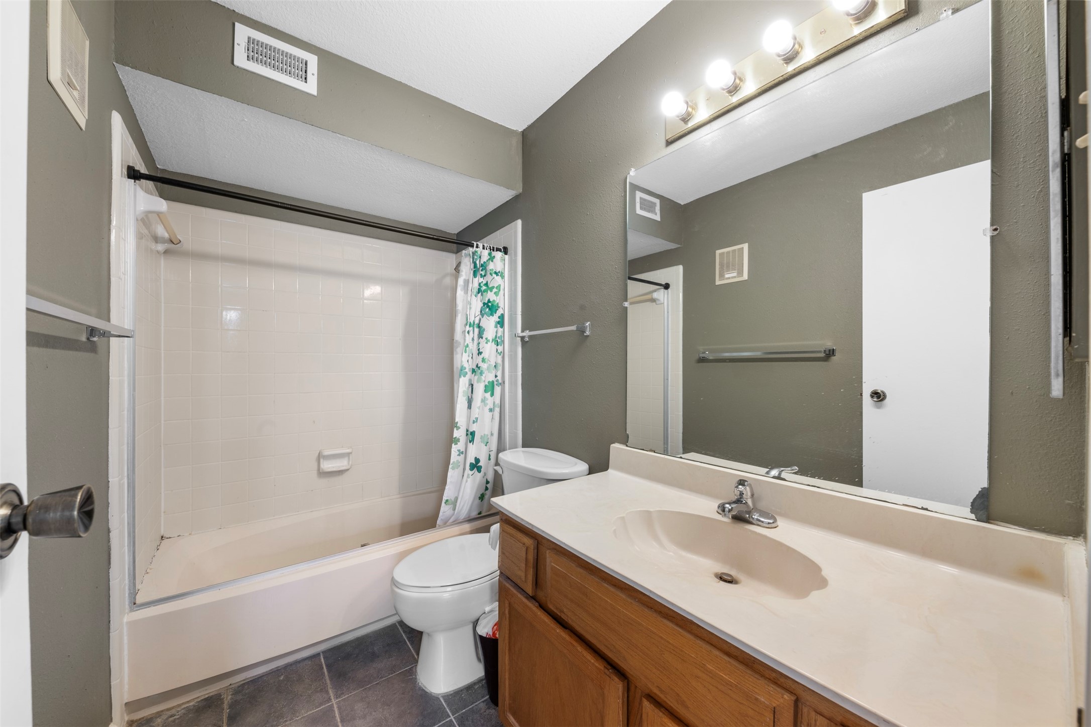 7617 Cambridge Street, Unit 7617 Houston, TX 77054 - Photo 14 of 20 a bathroom with a sink a toilet and shower
