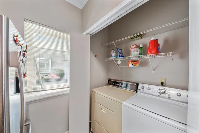 a utility room with dryer and washer