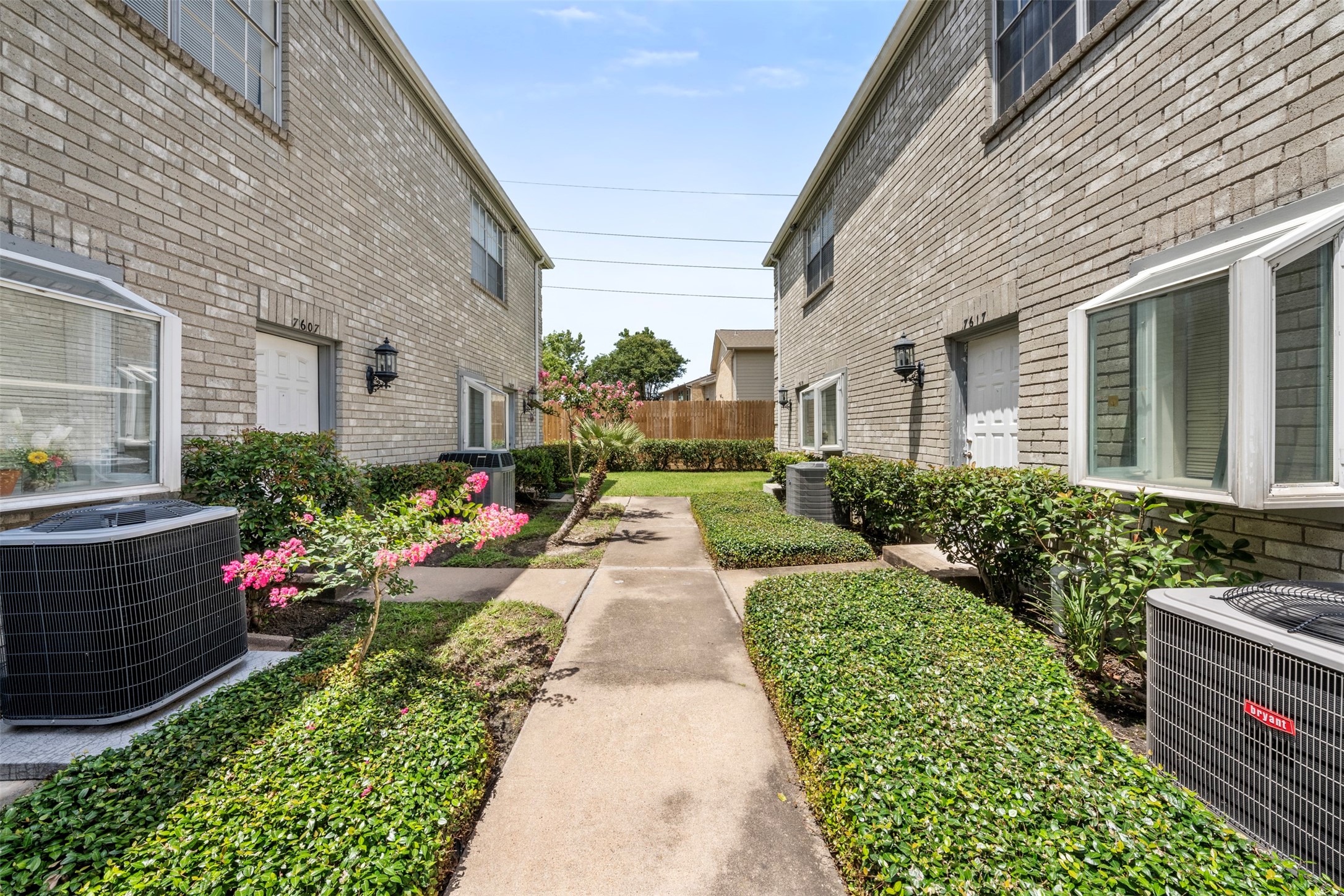 7617 Cambridge Street, Unit 7617 Houston, TX 77054 - Photo 19 of 20 a view of a house with a flower garden