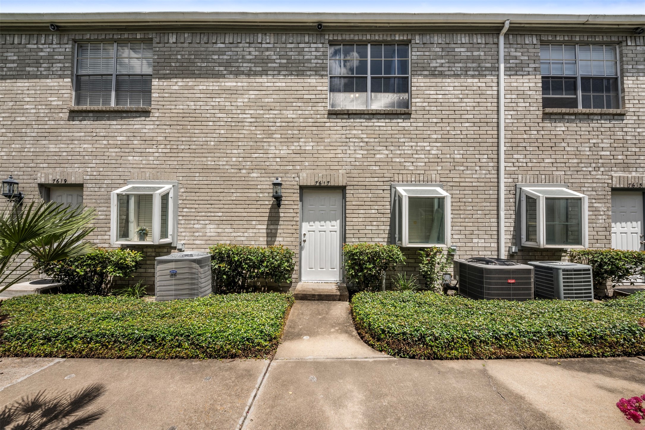 7617 Cambridge Street, Unit 7617 Houston, TX 77054 - Photo 2 of 20 a front view of a house with a yard