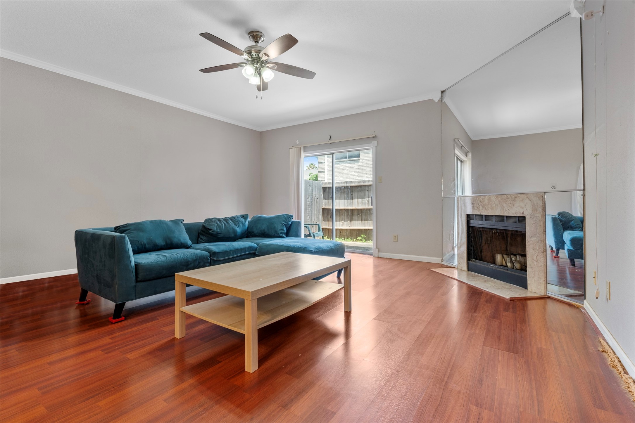 7617 Cambridge Street, Unit 7617 Houston, TX 77054 - Photo 5 of 20 a living room with furniture and a fireplace
